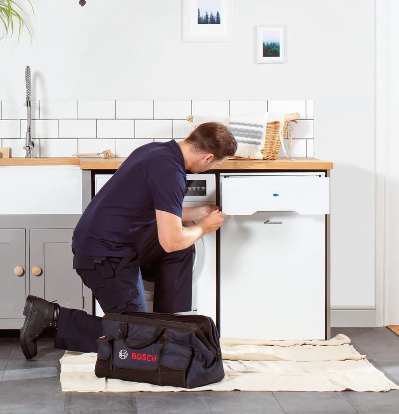 Engineer servicing a boiler